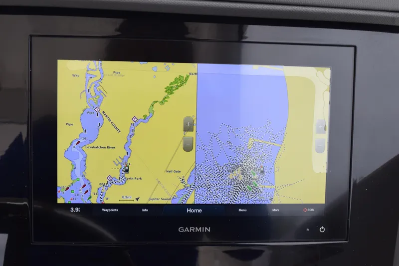 Slide: The Image of Garmin navigation display on 2022 Pursuit OS 355 Offshore boat, showing marine map. - 281