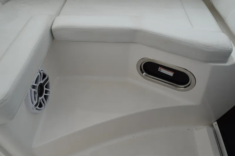 Slide: The Image of 2022 Pursuit OS 355 Offshore boat interior with cushioned seating and speaker. - 237