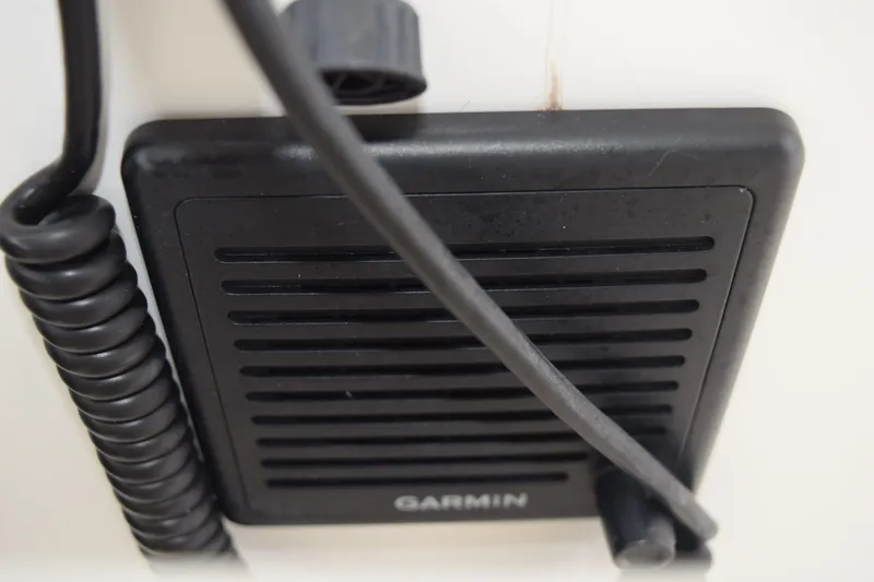 Slide: The Image of Garmin speaker on 2022 Pursuit OS 355 Offshore boat, featuring coiled cable. - 263