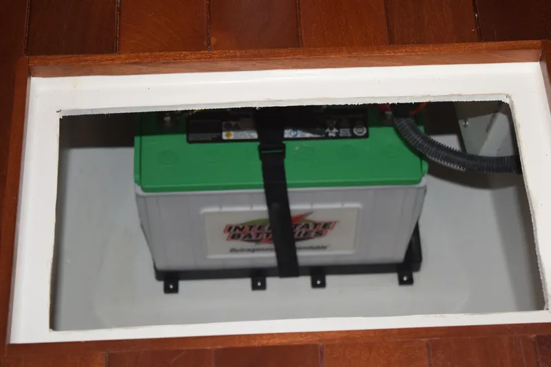 Slide: The Image of Battery compartment of 2022 Pursuit OS 355 Offshore boat, featuring Interstate battery. - 437