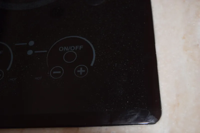 Slide: The Image of Control panel of 2022 Pursuit OS 355 Offshore boat, featuring on/off and adjustment buttons. - 389