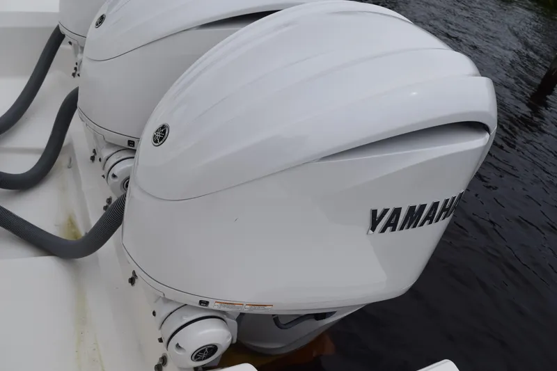Slide: The Image of Twin Yamaha outboard engines on a 2022 Pursuit OS 355 Offshore boat. - 87