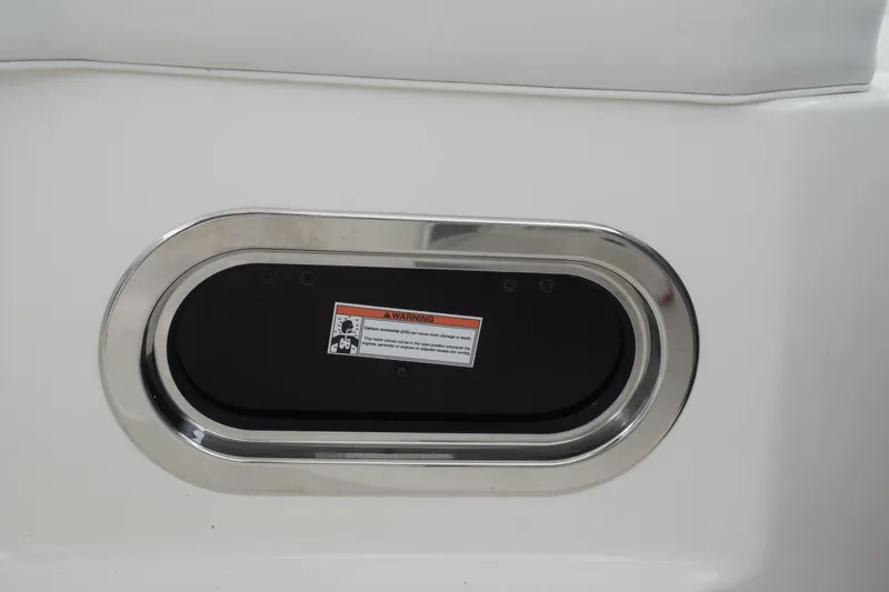 Slide: The Image of 2022 Pursuit OS 355 Offshore boat detail with warning label and stainless steel trim. - 244