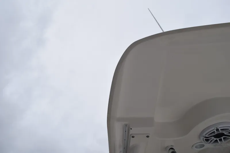 Slide: The Image of 2022 Pursuit OS 355 Offshore boat roof against cloudy sky. - 154