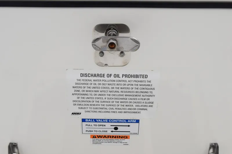 Slide: The Image of 2022 Pursuit OS 355 Offshore warning label prohibiting oil discharge, featuring ball valve control instructions. - 127