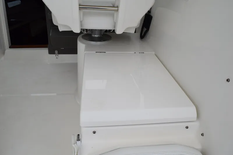 Slide: The Image of 2022 Pursuit OS 355 Offshore boat interior, featuring sleek white seating and modern design. - 177