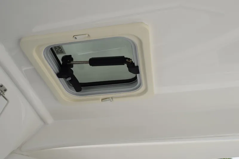 Slide: The Image of Hatch window on 2022 Pursuit OS 355 Offshore boat ceiling. - 214