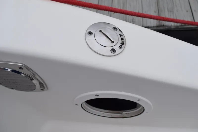Slide: The Image of 2022 Pursuit OS 355 Offshore boat waste disposal port detail. - 104