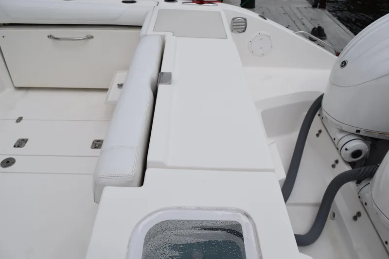 Slide: The Image of 2022 Pursuit OS 355 Offshore boat deck with seating and engine view. - 63