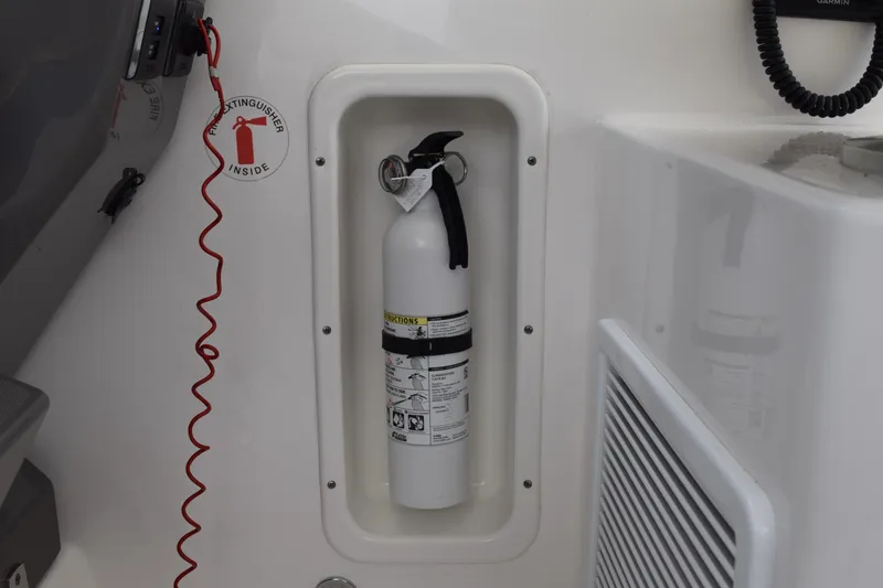 Slide: The Image of Fire extinguisher in 2022 Pursuit OS 355 Offshore boat compartment. - 266