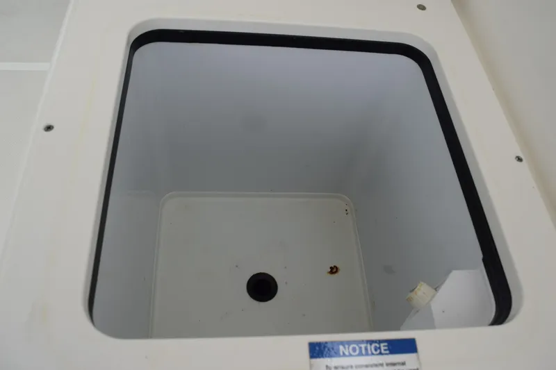 Slide: The Image of Open storage compartment on 2022 Pursuit OS 355 Offshore boat. - 180