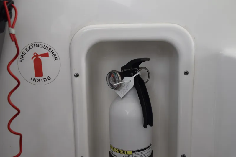 Slide: The Image of Fire extinguisher compartment on 2022 Pursuit OS 355 Offshore boat. - 268