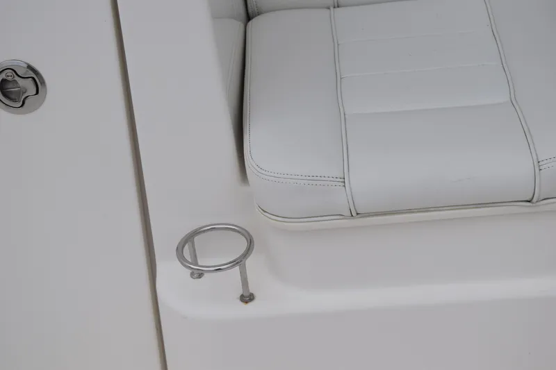 Slide: The Image of 2022 Pursuit OS 355 Offshore boat seat with cup holder detail. - 34