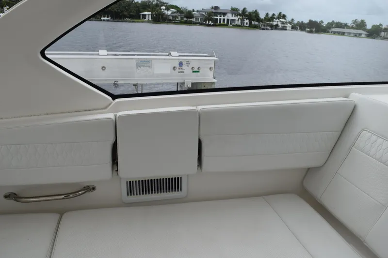 Slide: The Image of Interior of 2022 Pursuit OS 355 Offshore boat with white seating and water view. - 236