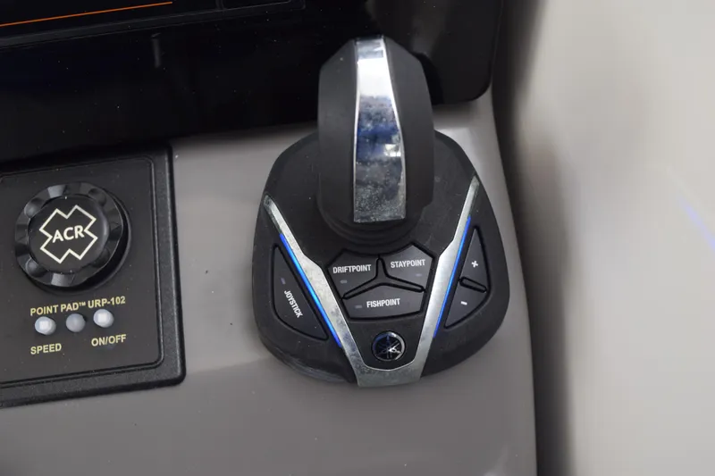 Slide: The Image of Control panel of 2022 Pursuit OS 355 Offshore boat with joystick and buttons. - 288