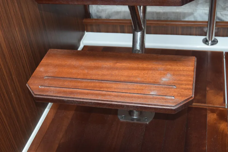 Slide: The Image of Wooden step detail on 2022 Pursuit OS 355 Offshore boat interior. - 344