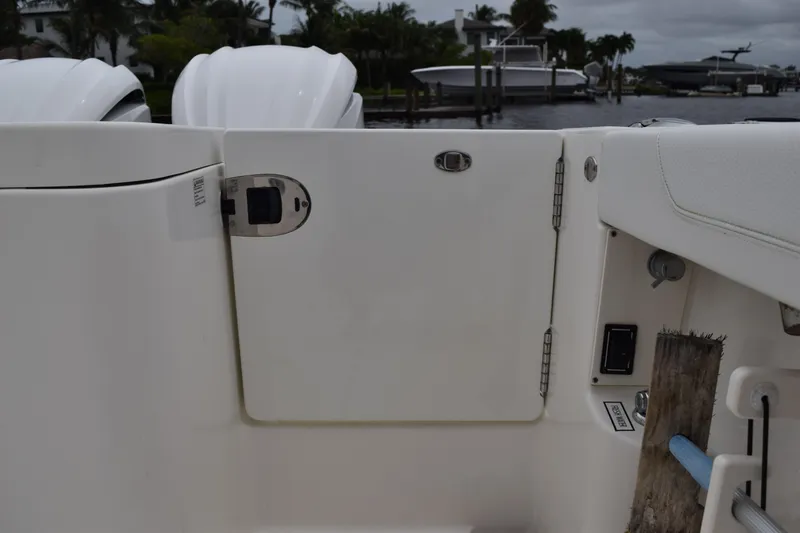 Slide: The Image of 2022 Pursuit OS 355 Offshore boat deck with storage compartment and seating. - 107
