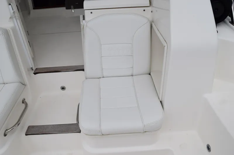 Slide: The Image of White seat on 2022 Pursuit OS 355 Offshore boat, featuring sleek design and comfortable upholstery. - 31