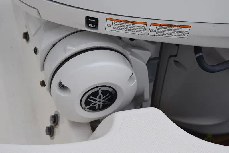 Slide: The Image of Close-up of a 2022 Pursuit OS 355 Offshore boat engine component with Yamaha logo. - 90