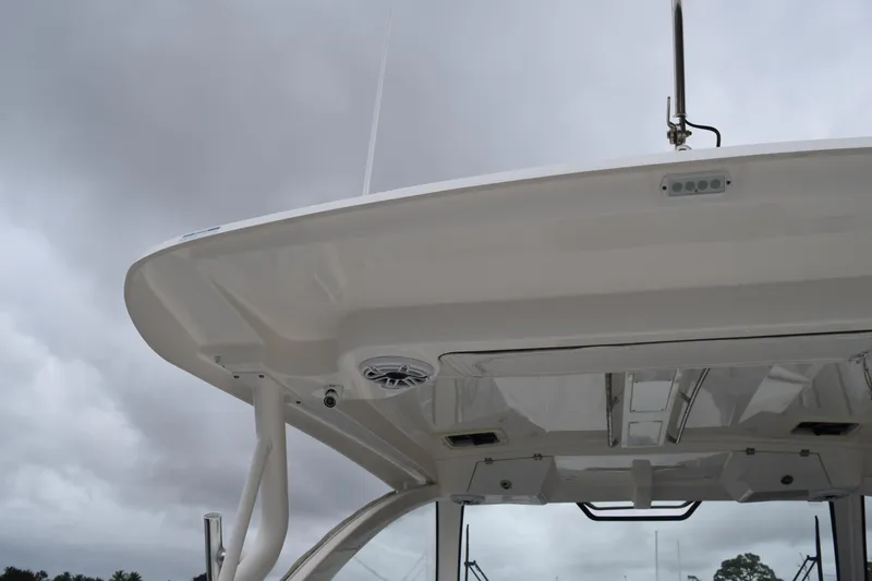 Slide: The Image of 2022 Pursuit OS 355 Offshore boat top view under cloudy sky. - 17