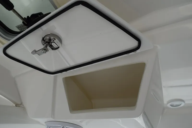 Slide: The Image of 2022 Pursuit OS 355 Offshore storage compartment with secure latch. - 220