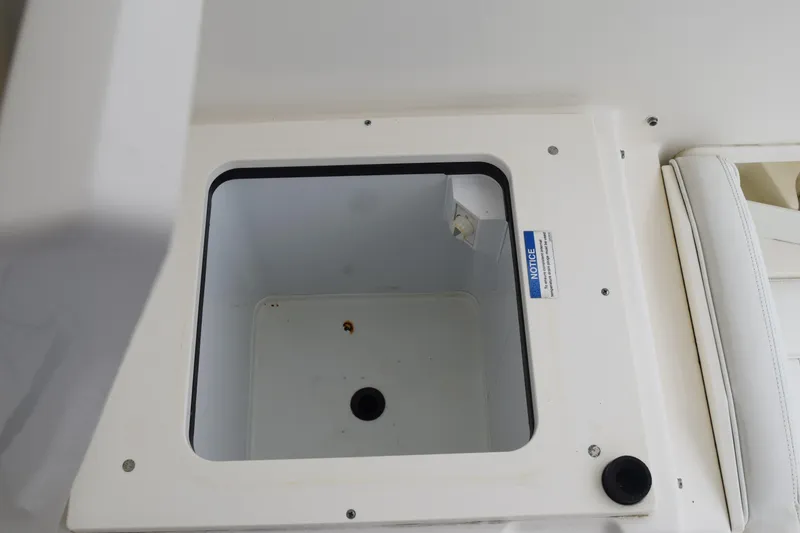 Slide: The Image of 2022 Pursuit OS 355 Offshore boat storage compartment, open and empty. - 181