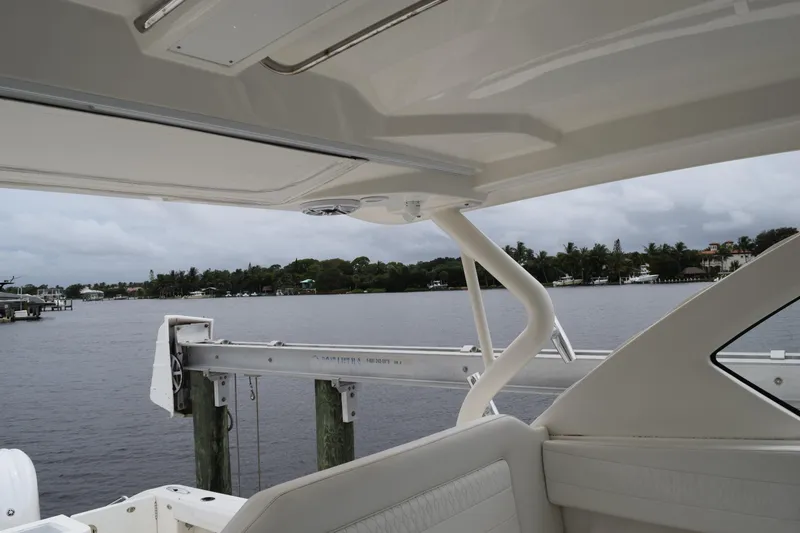 Slide: The Image of 2022 Pursuit OS 355 Offshore boat interior with waterfront view. - 308
