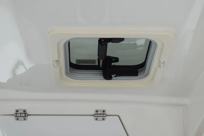Slide: The Image of 2022 Pursuit OS 355 Offshore boat hatch with secure locking mechanism. - 200