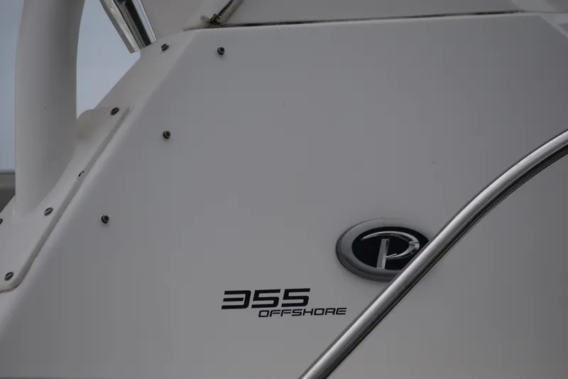 Slide: The Image of 2022 Pursuit OS 355 Offshore boat detail with logo and model name. - 462
