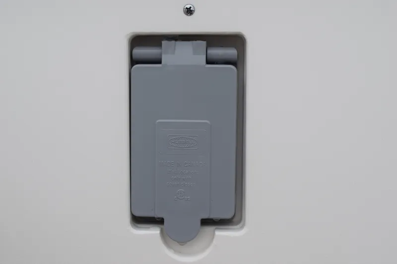 Slide: The Image of Gray electrical outlet cover on 2022 Pursuit OS 355 Offshore boat. - 40