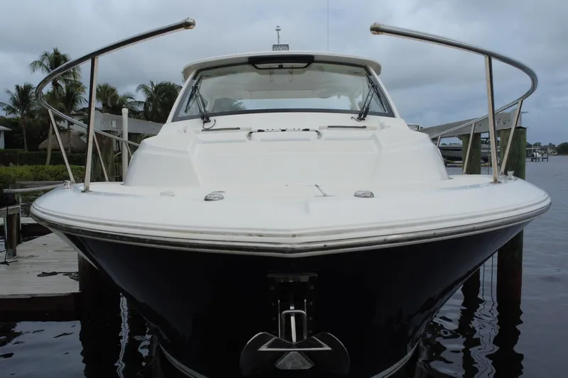 Slide: The Image of 2022 Pursuit OS 355 Offshore boat docked, front view with overcast sky. - 466