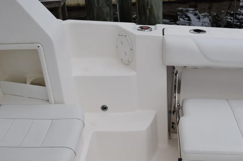 Slide: The Image of 2022 Pursuit OS 355 Offshore boat interior with white seating and steps. - 30