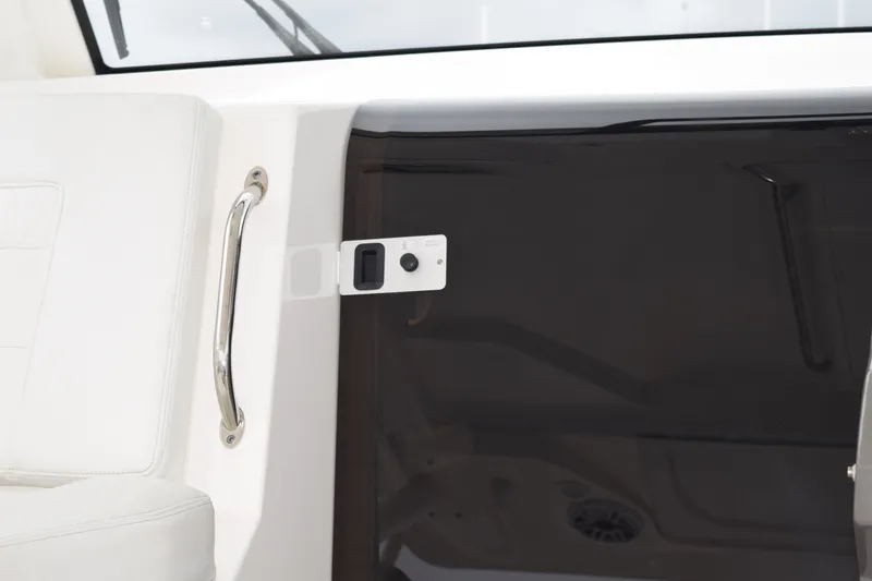 Slide: The Image of 2022 Pursuit OS 355 Offshore interior detail with white seating and chrome handle. - 314