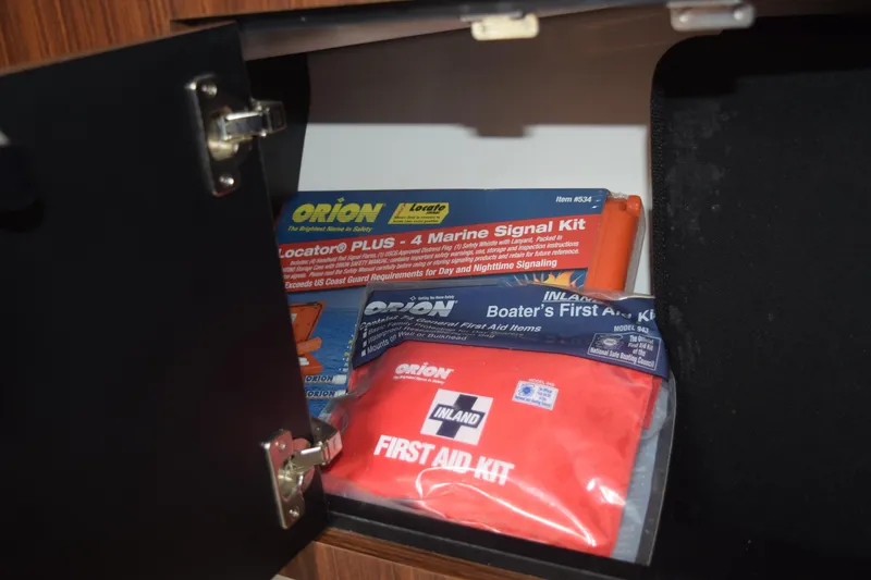Slide: The Image of First aid and marine signal kits in 2022 Pursuit OS 355 Offshore cabinet. - 392