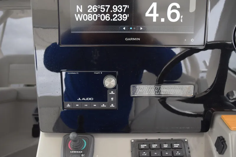 Slide: The Image of Control panel of 2022 Pursuit OS 355 Offshore boat with navigation and audio systems. - 274