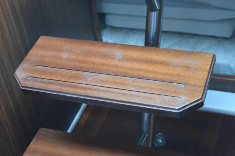 Slide: The Image of Wooden step detail on 2022 Pursuit OS 355 Offshore boat interior. - 336