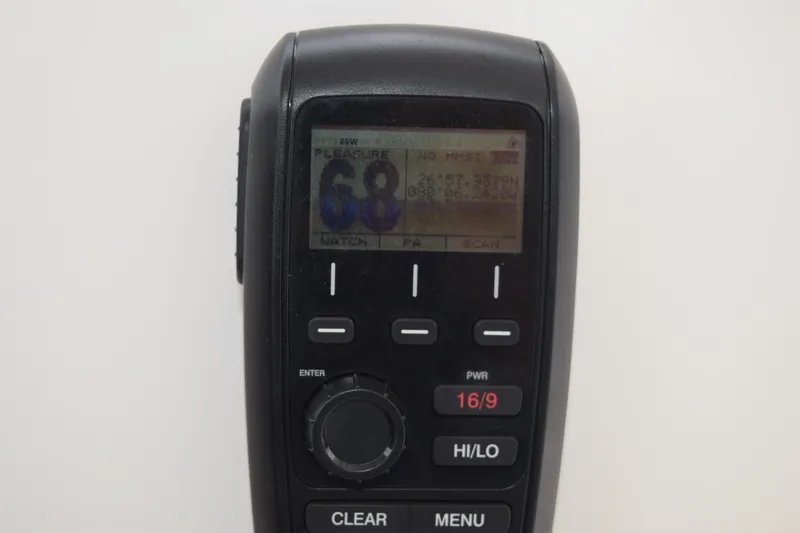 Slide: The Image of Close-up of a marine radio display on a 2022 Pursuit OS 355 Offshore boat. - 260