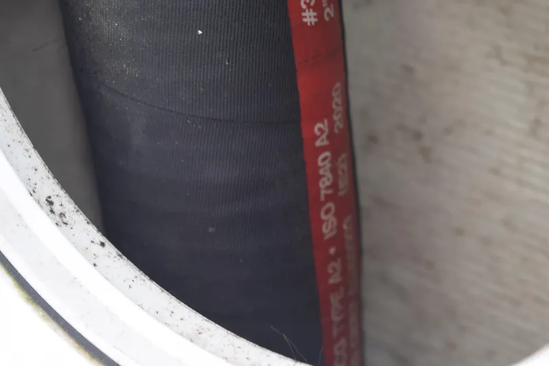 Slide: The Image of Close-up of a hose inside a 2022 Pursuit OS 355 Offshore boat. - 86