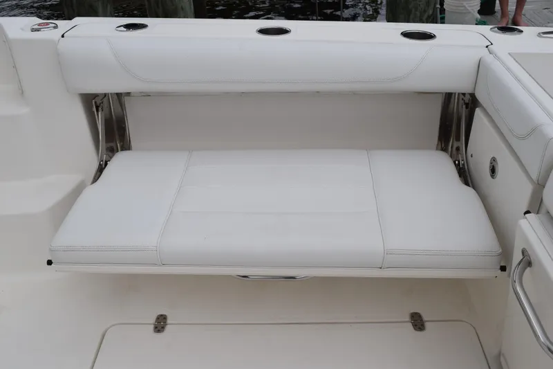 Slide: The Image of 2022 Pursuit OS 355 Offshore boat with white cushioned seating. - 28