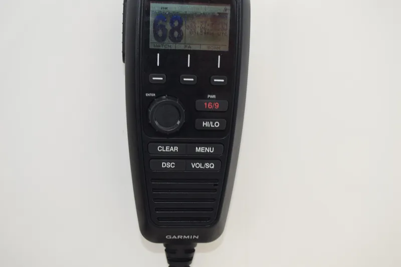 Slide: The Image of Garmin marine radio on 2022 Pursuit OS 355 Offshore boat, displaying channel 68. - 261