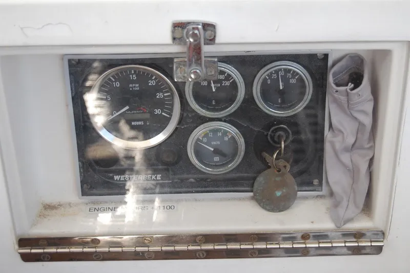 Slide: The Image of Instrument panel of a 1981 Bristol 40 Yawl sailboat with gauges and key. - 26