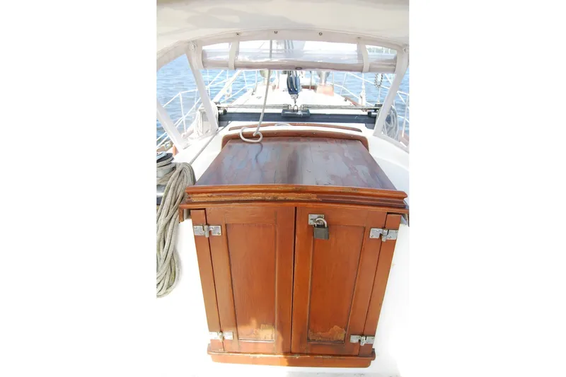 Slide: The Image of Wooden hatch on 1981 Bristol 40 Yawl sailboat deck, with nautical ropes and ocean view. - 25