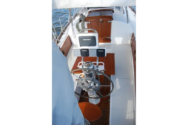 Slide: The Image of 1981 Bristol 40 Yawl cockpit with Raymarine navigation system and wooden accents. - 22