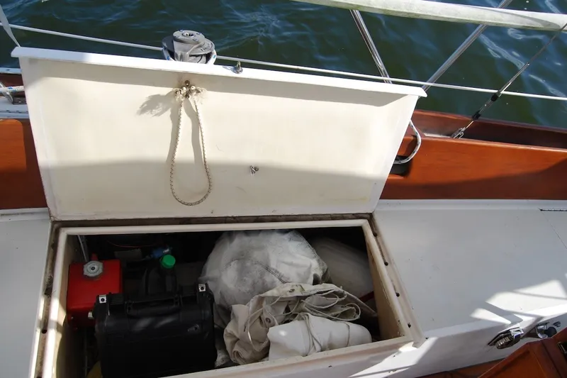 Slide: The Image of Open storage compartment on 1981 Bristol 40 Yawl sailboat with various equipment inside. - 27