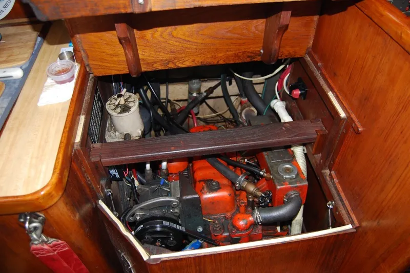 Slide: The Image of Engine compartment of a 1981 Bristol 40 Yawl sailboat, showcasing mechanical components. - 55