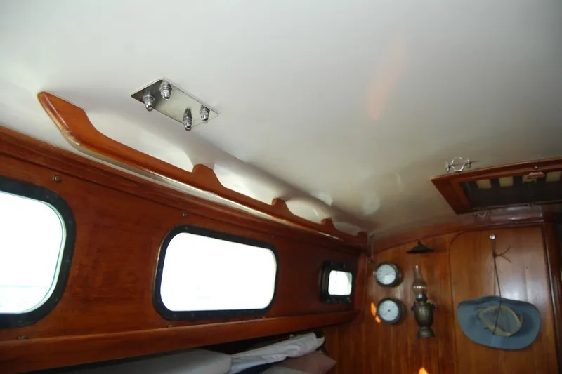 Slide: The Image of Interior of 1981 Bristol 40 Yawl sailboat with wooden paneling and nautical decor. - 53