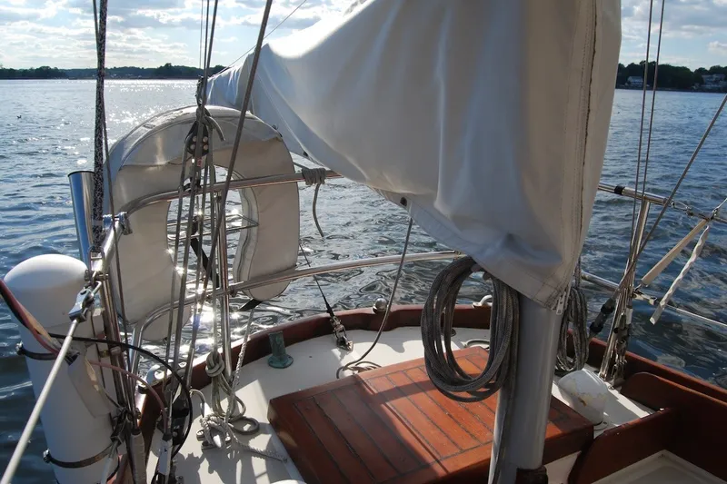 Slide: The Image of 1981 Bristol 40 Yawl sailboat deck with rigging and calm water view. - 12