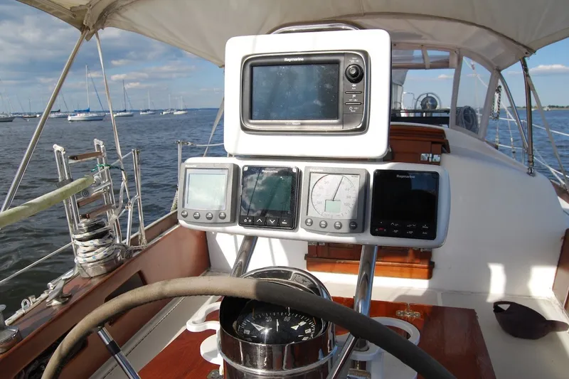 Slide: The Image of Cockpit of 1981 Bristol 40 Yawl with navigation instruments and steering wheel. - 20