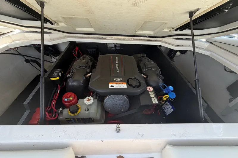 Slide: The Image of 2022 Regal LS2 boat engine compartment with Volvo Penta motor. - 60