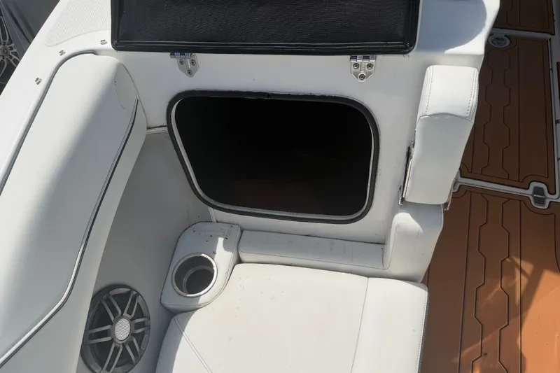 Slide: The Image of Interior of 2022 Regal LS2 boat showing seating, storage compartment, and speaker. - 47